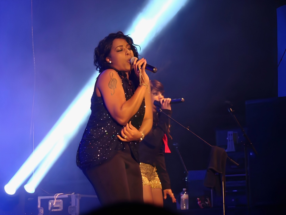 LoveToriBE singing during a live performance